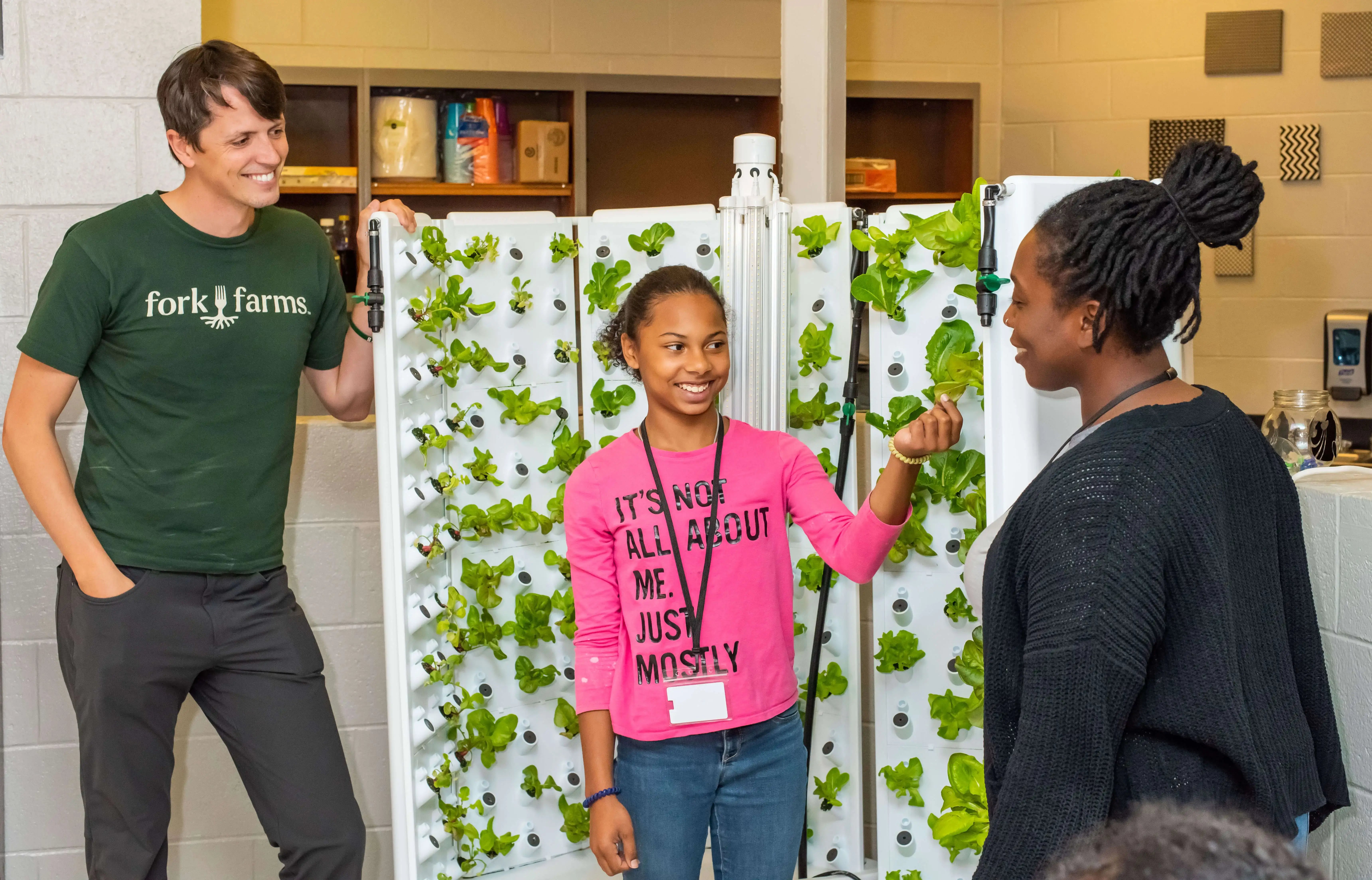Student Showing Off Lettuce Plant_Compressed